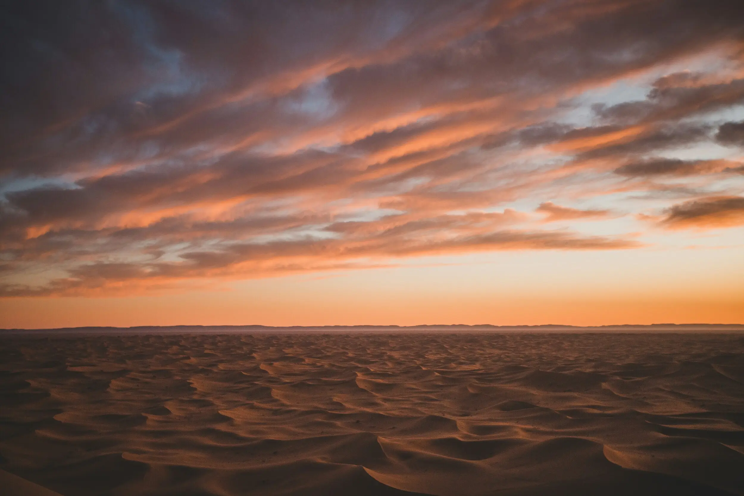 Moroccan sunset over desert dunes