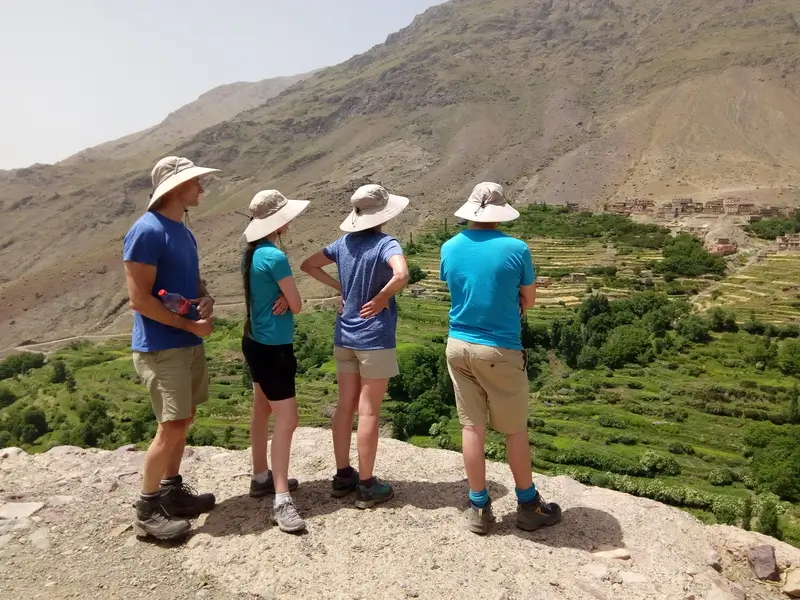 Local guide explaining Berber culture to guests in the Atlas Mountains